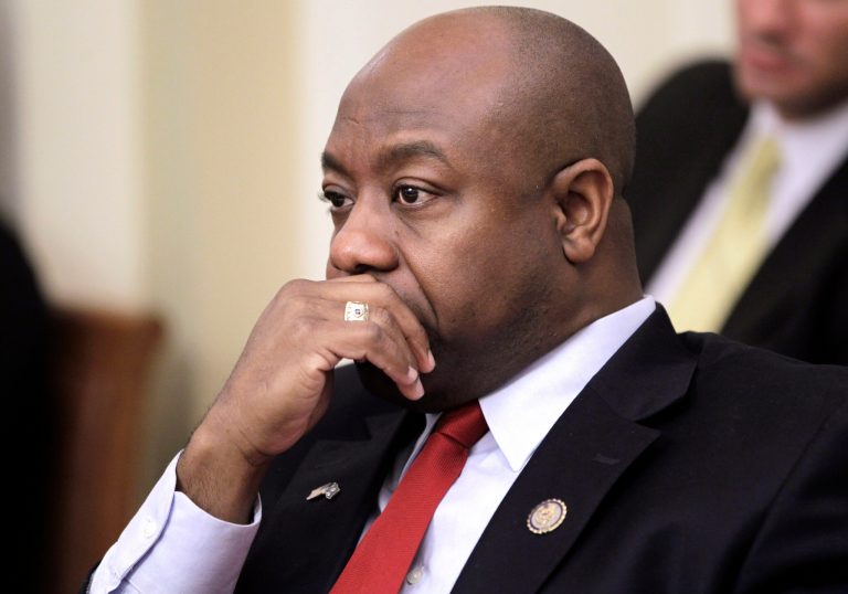   FILE - In this Jan. 6, 2011, file photo, Rep. Tim Scott, R-S.C. listens at a House Rules committee meeting, on Capitol Hill in Washington. A Washington GOP official says South Carolina Gov. Nikki Haley has chosen Rep. Tim Scott to replace Jim DeMint in the Senate. (AP Photo/Charles Dharapak, File)  