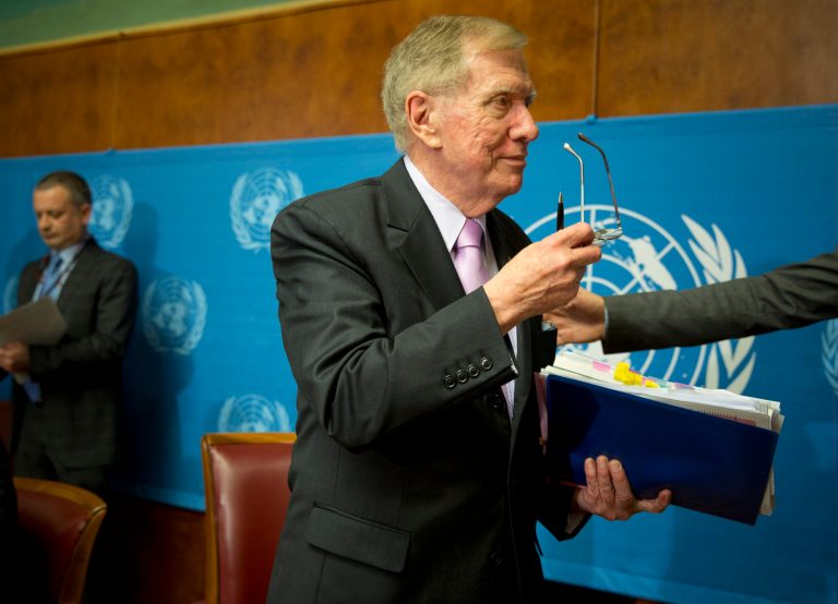 Retired Australian judge Michael Kirby, center, chairperson of the commission of Inquiry on Human Rights in the Democratic People's Republic of Korea, takes off his glasses after delivering the commission's report during a press conference at the United Nations in Geneva, Switzerland, Monday, Feb. 17, 2014. A U.N. panel has warned North Korean leader Kim Jong Un that he may be held accountable for orchestrating widespread crimes against civilians in the secretive Asian nation. Kirby told the leader in a letter accompanying a yearlong investigative report on North Korea that international prosecution is needed 