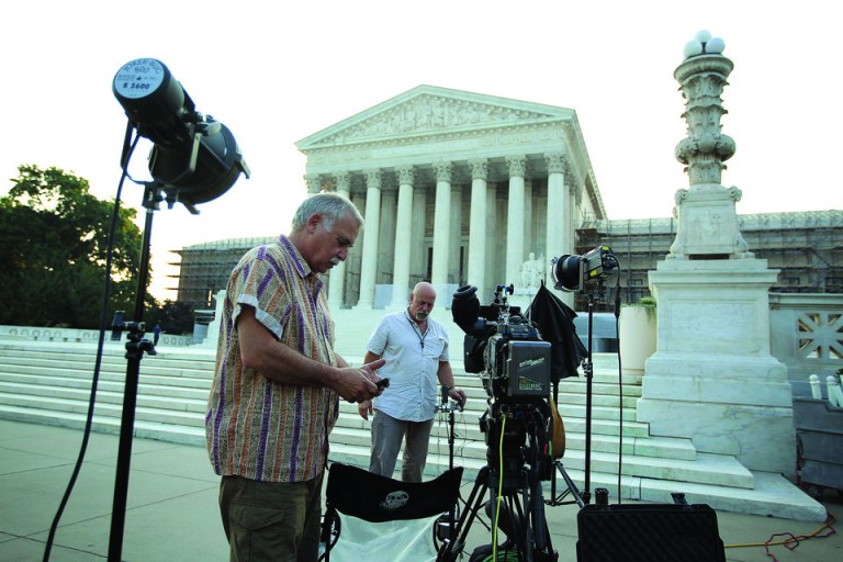 Jeff Johnston (R) and Gabe Stix (L) of CBS News set up their stake out position in front of the Supreme Court this week in anticipation of a ruling on Obamacare. (Photo by Alex Wong/Getty Images)