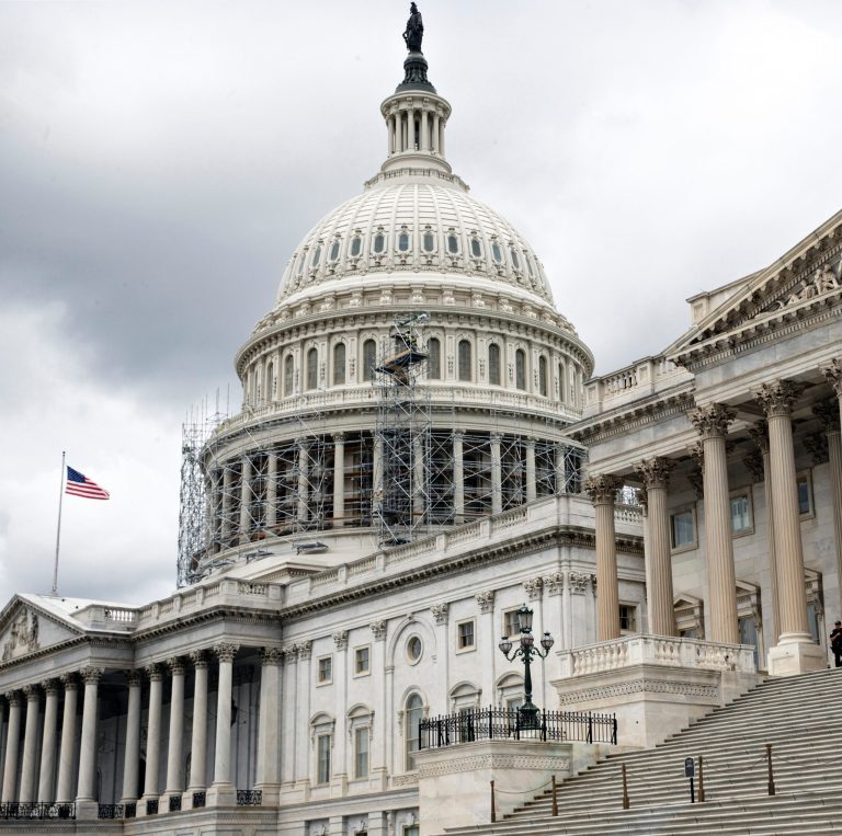 FILE - In this Sept. 8, 2014, file photo, workmen erect metal scaffolding pipe around the dome of the U.S. Capitol in Washington. Seven weeks before the elections, Republicans and Democrats are both playing it safe, willing to make short-term sacrifices of long-held positions in hopes of maximizing their chances for victory at the polls. That means that House Republicans who recently voted to sue Obama for allegedly failing to obey the Constitution seem likely to hand him new war powers to combat militants seeking an Islamic state. (AP Photo/J. Scott Applewhite, File)