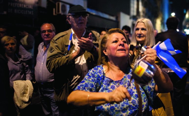 People bang pots in Plaza the Mayo as they protest the policies of Argentina's President Cristina Fernandez's government in Buenos Aires, Argentina, Thursday, Sept. 13, 2012. Mass protests against Fernandez's government took place in different cities on Thursday night. (AP Photo/Natacha Pisarenko)
