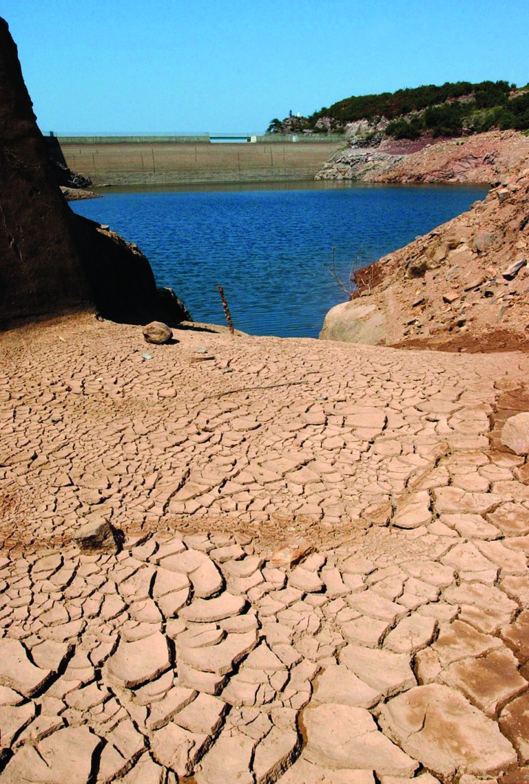 FILE - In this Aug. 19, 2003 file photo, the Ibardin lake, which provides drinking water to the southern French cities of Hendaye, Biriatu and Urrugne, is almost dry due to the recent heat wave, near the French-Spanish border. The relentless, weather-gone-crazy type of heat that has blistered the United States and other parts of the world in recent years is so rare and off-the-charts that it can't be anything but man-made global warming, a new statistical analysis from a top government scientist says. (AP Photo/Bob Edme, File)