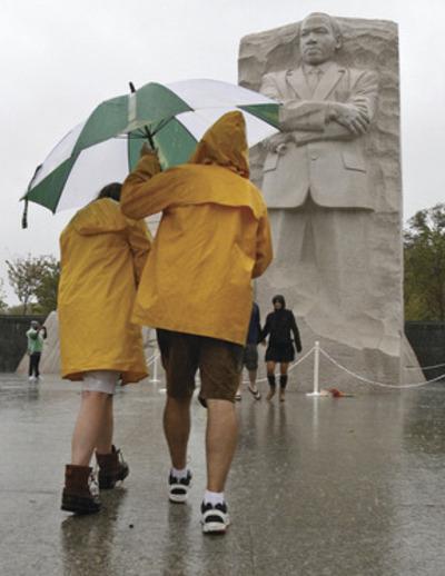 J. David Ake/AP
Above, Hurricane Irene caused havok in the District, downing many trees and delaying the dedication of the Martin Luther King Jr. Memorial. Top left, a 5.9 magnitude earthquake centered in Virginia forced evacuations of all the monuments on the National Mall in Washington. At left, A major snowstorm last winter snarled traffic for hours in the D.C. area, trapping motorists in their vehicles.