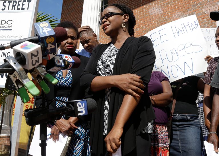 Haitian-American author Edwidge Danticat speaks during a news conference at the Haitian Women of Miami headquarters, Monday, Oct. 21, 2013, in Miami. Haitians who believe their relatives were among 15 people aboard a boat that capsized off Miami last week are calling on U.S. officials to release more information about the accident's survivors, saying none of their names has been released. They also are calling on U.S. Immigration and Customs Enforcement to release the survivors who were detained. (AP Photo/Lynne Sladky)