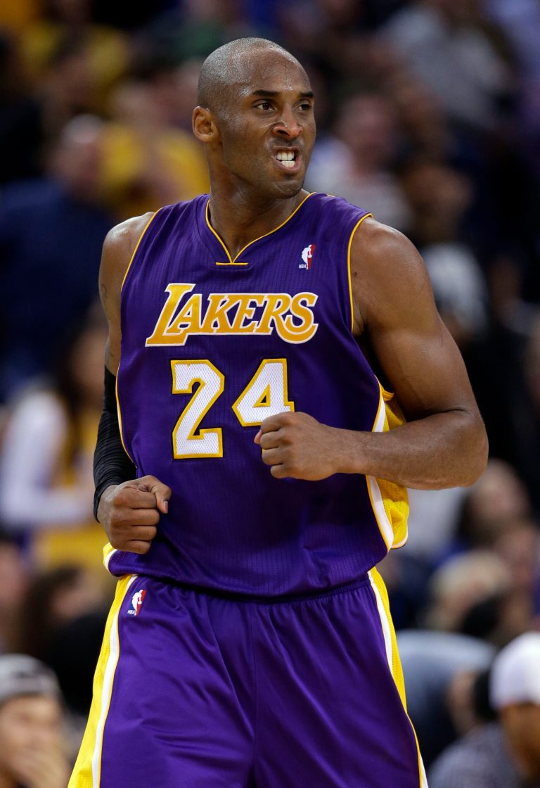   Los Angeles Lakers' Kobe Bryant (24) reacts after scoring against the Golden State Warriors during the second half of an NBA basketball game in Oakland, Calif., Saturday, Dec. 22, 2012. Los Angeles won in overtime 118-115. (AP Photo/Marcio Jose Sanchez)  