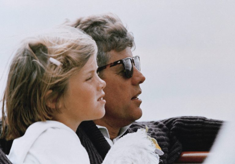 FILE - In this 1962 file photo, President John F. Kennedy and his daughter, Caroline, sail off Hyannis Port, Mass. (AP Photo)