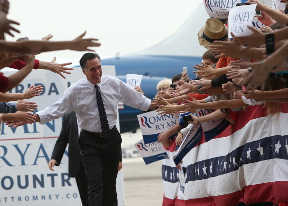 SANFORD, FL - NOVEMBER 05:  Republican presidential candidate, former Massachusetts Gov. Mitt Romney greets supporters during a campaign rally at Avion Jet Center on November 5, 2012 in Sanford, Florida. With one day to go until election day, Mitt Romney is making one final push throughout swing states.  (Photo by Justin Sullivan/Getty Images)