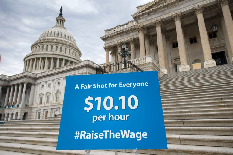 A chart prepared by Senate Democrats rests on an easel on the Senate steps before a news conference urging approval for raising the minimum wage, at the Capitol on April 2. (AP/J. Scott Applewhite)