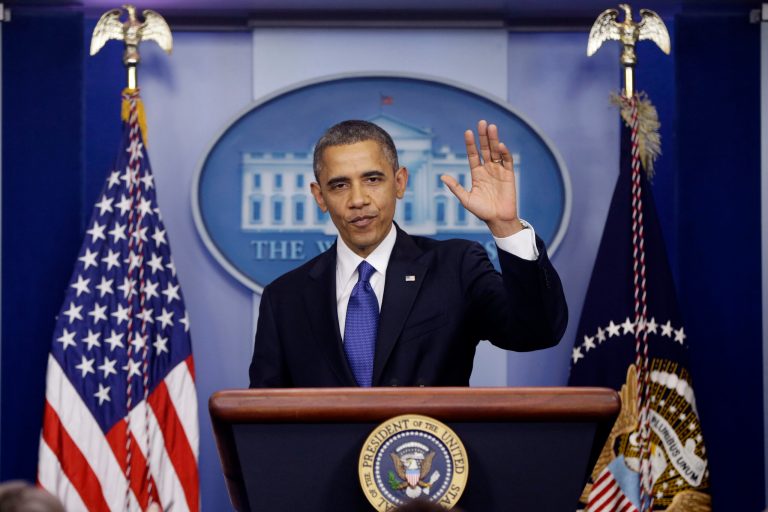   President Barack Obama waves as he leaves the podium after speaking about the fiscal cliff in the Brady Press Briefing Room at the White House in Washington, Friday, Dec. 21, 2012. (AP Photo/Charles Dharapak)  