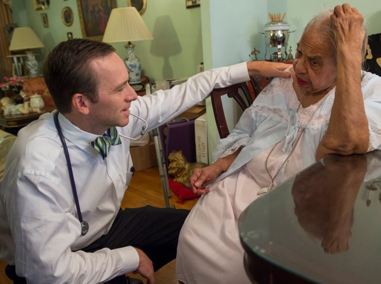 Dr. Eric De Jonge of Washington Hospital Center conducts a Medicare house call at the home of patient Beatrice Adams, in Washington, Thursday, Aug. 7, 2014. (AP Photo/Molly Riley)