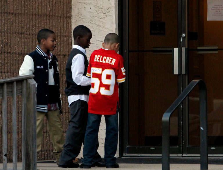   Mourners attend the wake for Kansas City Chiefs linebacker Jovan Belcher, Tuesday, Dec. 11, 2012, at Upper Room Christian World Center in Dix Hills, N.Y. Police say the West Babylon, N.Y., native fatally shot himself Dec. 1, after he killed his girlfriend, 22-year-old Kasandra Perkins, the mother of their 3-month-old daughter Zoey. (AP Photo/John Dunn)  