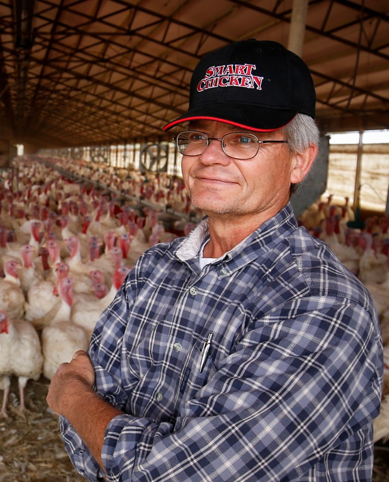 ADVANCE FOR USE SUNDAY, OCT. 19 - In this photo taken on Oct. 9, 2014, Bill Bevans poses for a portrait in one of the barns of his turkey farm north of Waverly, Neb. Bevans produces hundreds of thousands of turkeys on two properties, one north of Waverly and the other south, but the market for the birds has reached a limit, he told the Lincoln Journal Star. (AP Photo/The Journal-Star, Dan Little) LOCAL TELEVISION OUT; KOLN-TV OUT; KGIN-TV OUT; KLKN-TV OUT