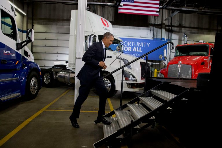 President Barack Obama arrives to speak about how having a fuel-efficient truck fleet will boost the economy and help combat climate change, Tuesday, Feb. 18, 2014, at the Safeway Distribution Center in Upper Marlboro, Md. (AP Photo/Jacquelyn Martin)