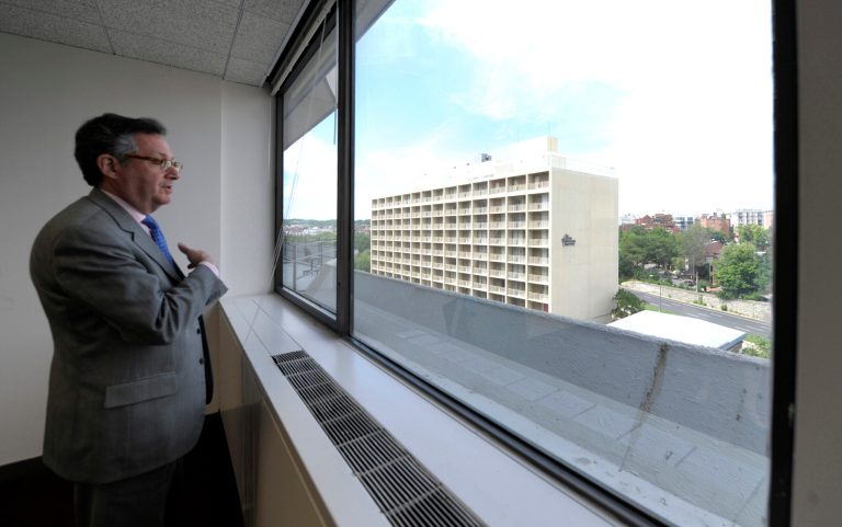   In this photo taken May 30, 2012, Penzance senior adviser Peter Greenwald looks out of a window from an office on the sixth floor of the Watergate Office Building in Washington. This particular office space is believed to be the former headquarters of the Democratic National Committee offices that were burglarized 40 years ago. The building out of the window is the former Howard Johnson's Hotel. Forty years ago police in Washington arrested five men breaking in to the Democratic National Committee offices in Washington. The name of the complex they were breaking into became infamous: the Watergate. These days, though, unless you know where to look, thereÃ­s little marking the location of the 1972 crime that ultimately led to the resignation of President Richard Nixon. The office building that was the site of the break in is still in use, though the tenants have changed. The adjacent hotel where the burglars stayed is currently closed. And another hotel across the street where a lookout waited with a walkie-talkie, monitoring the burglarsÃ­ progress, has been turned into a college dorm. (AP Photo/Susan Walsh)  