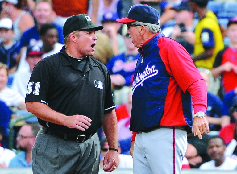 David Tulis/AP
Nationals manager Davey Johnson was thrown out of the game for arguing what TV replays showed was a blown call at first base in the sixth that led to two runs.