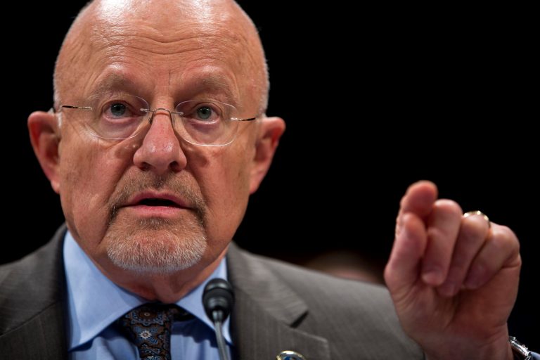 FILE - In this Oct. 29,2013 file photo, Director of National Intelligence James Clapper testifies on Capitol Hill in Washington. Clapper is declassifying more documents that show how the National Security Agency was first authorized to start collecting bulk phone and Internet records in the hunt for al-Qaida terrorists. Clapper explains in a statement on Dec. 21 that President George W. Bush first authorized the spying as part of the Terrorist Surveillance Program, just after the Sept. 11 attacks. (AP Photo/ Evan Vucci, File)