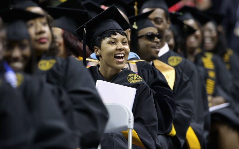 Graduates cheer as First lady Michelle Obama delivers the commencement speech during the Bowie State University graduation ceremony at the Comcast Center on the campus of the University of Maryland May 17, 2013 in College Park, Maryland. (Photo by Chip Somodevilla/Getty Images)