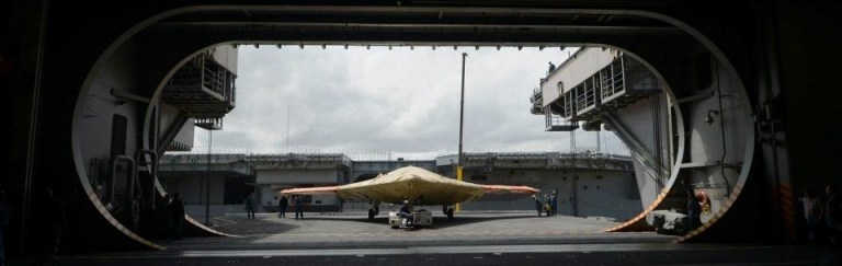 In this image provided by the U.S. Navy an X-47B Unmanned Combat Air System demonstrator sits on an aircraft elevator of the aircraft carrier USS George H.W. BushMonday May 6, 2013. The George H.W. Bush is scheduled to be the first aircraft carrier to catapult-launch an unmanned aircraft from its flight deck Tuesday May 14, 2013. (AP Photo/US Navy, Specialist 2nd Class Tony D. Curtis)