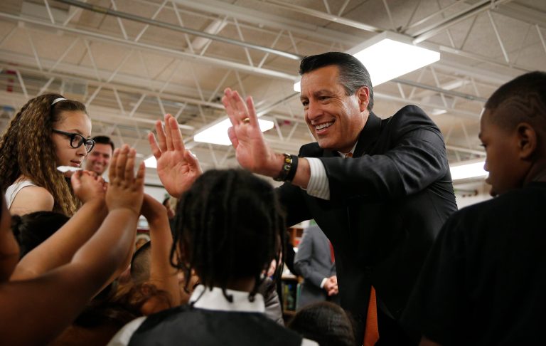 Nevada Governor Brian Sandoval greets at Matt Kelly Elementary School on June 3, 2015, in Las Vegas. He signed into law a bill creating the state'sÂ school choice program, which usesÂ education savings accounts.Â (AP Photo/John Locher)