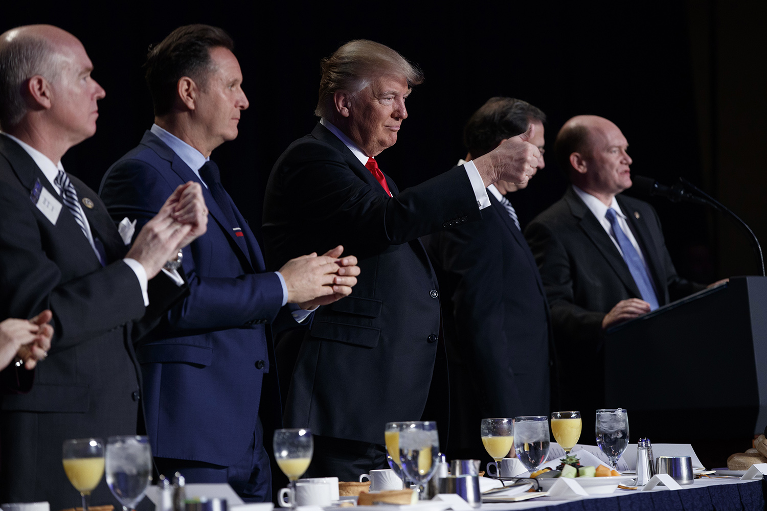 Trump uses National Prayer Breakfast to press immigration ban