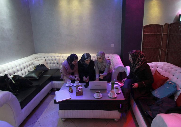 Abeer Abu Ghaith, 29, third from left, the first female high-tech entrepreneur in the West Bank, talks to other Palestinian women in the village of Dura. Abu Ghaith set up an Internet employment brokerage and software development firm and has been relentless in the pursuit of her goals, showing how the Palestinian IT sector could transform the lives of other women by giving them access to jobs and financial independence. (AP Photo/Nasser Shiyoukhi)