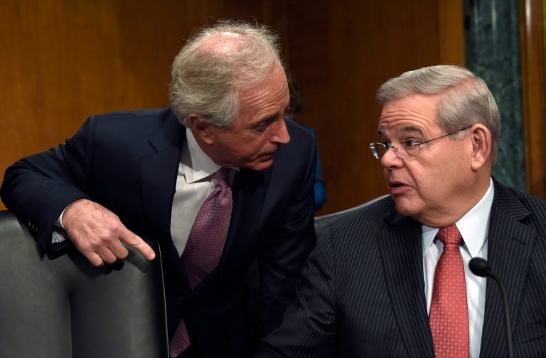 Senate Banking Committee members Sen. Bob Menendez, D-N.J., right, and Sen. Bob Corker, R-Tenn. talk on Capitol Hill in Washington, Tuesday, Jan. 27, 2015, before the start of the committee's hearing on Iran sanctions. (AP Photo/Susan Walsh)