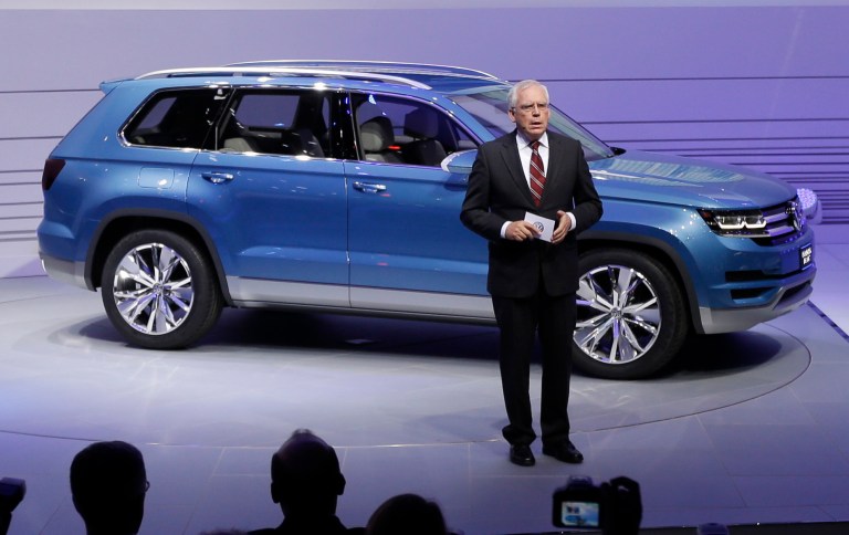 Ulrich Hackenberg, Volkswagen Director of Produce Development for Power Trains, stands next to the Volkswagen CrossBlue SUV concept vehicle during the North American International Auto Show in Detroit. (AP Photo/Carlos Osorio, File)