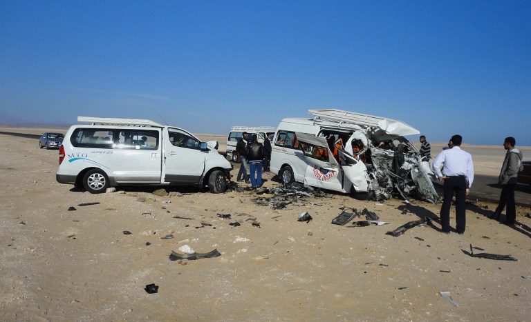   The aftermath of a two-vehicle accident, which left at least four Germans and several Egyptians dead and others injured, is seen on the road between Hurghada and Safaga on the Red Sea coast of Egypt, Sunday, Dec. 2, 2012. Egypt's roads are among the most dangerous in the world. Car accidents are common due to lax enforcement of driving laws and poorly paved roads, leading to thousands of deaths each year. (AP Photo)  