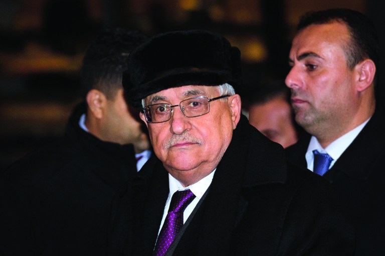 Palestinian President Mahmoud Abbas arrives at the United Nations Plaza Hotel, Tuesday, Nov. 27, 2012, in New York. The Palestinians predicted a historic U.N. vote recognizing their statehood this week, praising important new support from France on Tuesday and likely backing from other European nations seen as critical to enhancing their international standing. (AP Photo/John Minchillo)