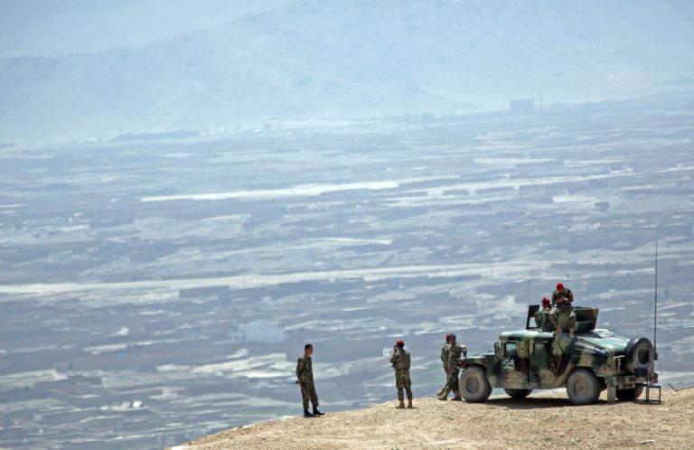FILE - This April 30, 2014 file photo shows Afghan National Army (ANA) soldiers standing guard during a military exercise on the outskirts of Kabul, Afghanistan. The Afghan National Security Forces depend exclusively on billions of dollars in funding from the US and its allies, money that is now at risk after President Hamid Karzai's refusal to sign a security agreement to keep a small U.S. force of trainers in the country after the NATO-led coalition ends its mission and withdraws at the end of the year. Alongside the exodus of US troops from Afghanistan before the end of the year, soldiers who hail from countries like Singapore and Slovenia, Mongolia and Malaysia have been packing up too, leaving behind an ever-shrinking NATO coalition. (AP Photo/Massoud Hossaini, File)