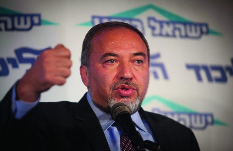 Israel's Foreign Minister Avigdor Lieberman speaks to the media during an event in Tel Aviv, Israel, Thursday, Dec. 13, 2012. Israel's powerful foreign minister resisted calls to resign after he was charged Thursday with breach of trust for actions that allegedly compromised a criminal investigation into his business dealings, throwing the country's election campaign into disarray just weeks before the vote. (AP Photo/Dan Balilty)