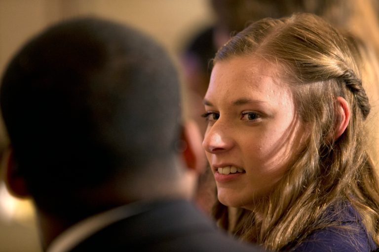 Rebecca Jasen, of Amherst, N.Y., attends a Tumblr forum where President Barack Obama answered questions from the State Dining Room of the White House in Washington, Tuesday, June 10, 2014. (AP Photo/Jacquelyn Martin)