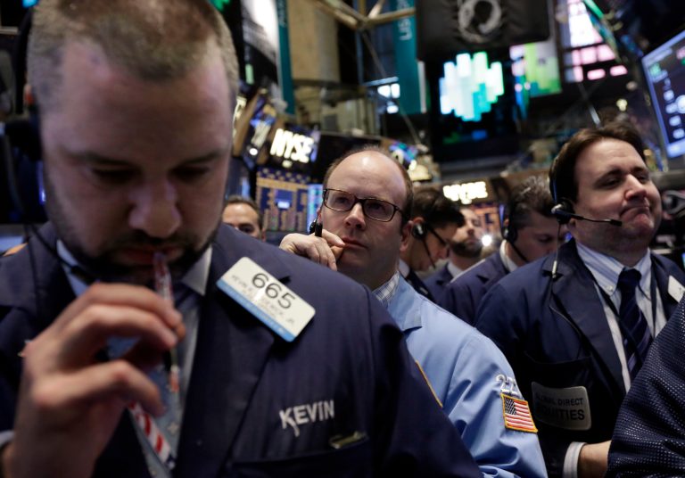 Traders work on the floor of the New York Stock Exchange, Friday, April 11, 2014. Weaker earnings at JPMorgan Chase are dragging bank stocks lower in early trading.Technology and biotech stocks also fell, a day after the worst rout for the Nasdaq composite index since 2011.(AP Photo/Richard Drew)