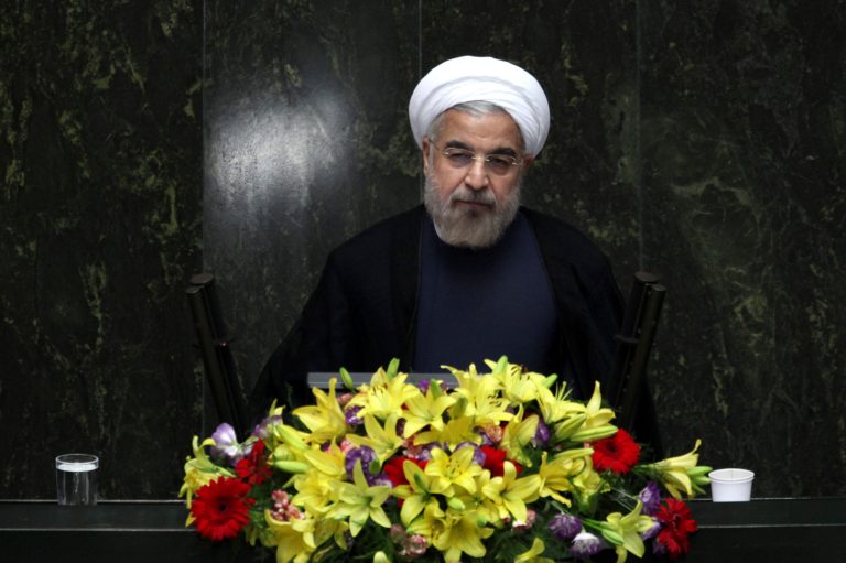   FILE - In this Aug. 15, 2013, file photo, Iranian President Hasan Rouhani speaks during the debate on the proposed Cabinet at the parliament, in Tehran, Iran. New signs are emerging that international sanctions are taking a deepening toll on Iran's economy _ putting tens of billions of dollars in oil money out of the government's reach. Yet there is no indication the distress is achieving the West's ultimate goal of forcing the Islamic Republic to halt its nuclear program. (AP Photo/Ebrahim Noroozi)  