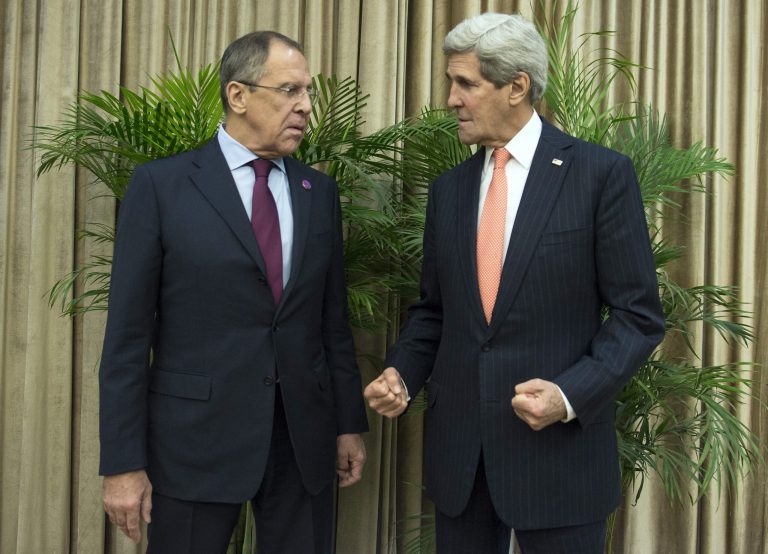 Secretary of State John Kerry, right, spoke with Russian Foreign Minister Sergei Lavrov, left, on Saturday to discuss reports of a Russian military build-up in Syria.Â (AP Photo/Nicholas Kamm, Pool)
