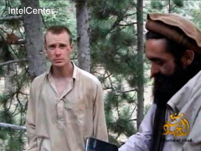 This file Image provided by IntelCenter on Dec. 8, 2010, shows a frame grab from a video released by the Taliban containing footage of a man believed to be Bowe Bergdahl, left. Saturday, May 31, 2014. (AP Photo/IntelCenter, File)