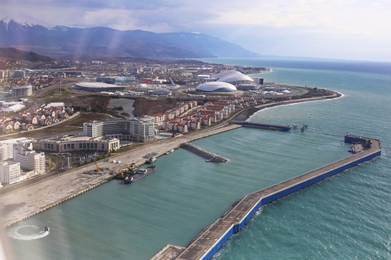 A view of the Olympic Park and seaside of the Russian Black Sea resort of Sochi, Russia, Monday, Jan. 27, 2014. Russia has spent about $51 billion to deliver the Winter Olympics in Sochi, which run Feb. 7-23. (AP Photo/Pavel Golovkin)
