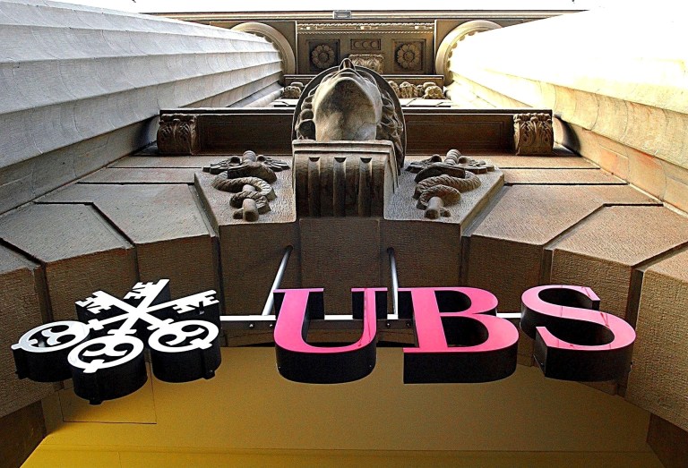   FILE - The logo of Swiss bank UBS is seen in Zurich, Switzerland, in this Dec. 18, 2001 picture. UBS reported a first quarter net profit of 2.42 billion Francs ($1.89 billion) in this May 4, 2004 file photo. Swiss bank UBS announced Wednesday Dec. 19, 2012 to pay 1.4 billion Swiss francs (US$ 1.53 billion) in fines to resolve investigations that it helped manipulate the benchmark LIBOR interest rate. (AP Photo/Keystone, Steffen Schmidt, File)  