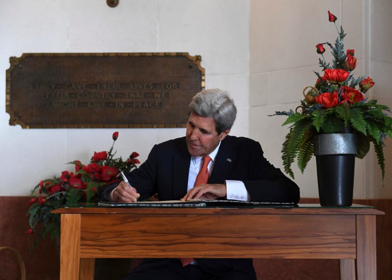 John Kerry makes a deal. (Mark Ralston/Pool Photo via AP)