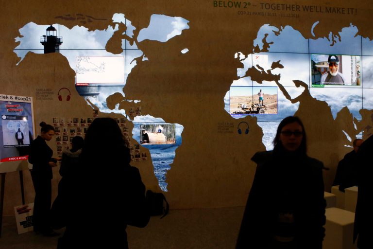 Countries negotiating cuts in greenhouse gas emissions need to pick up the pace, environmental group says. (AP Photo/Francois Mori)