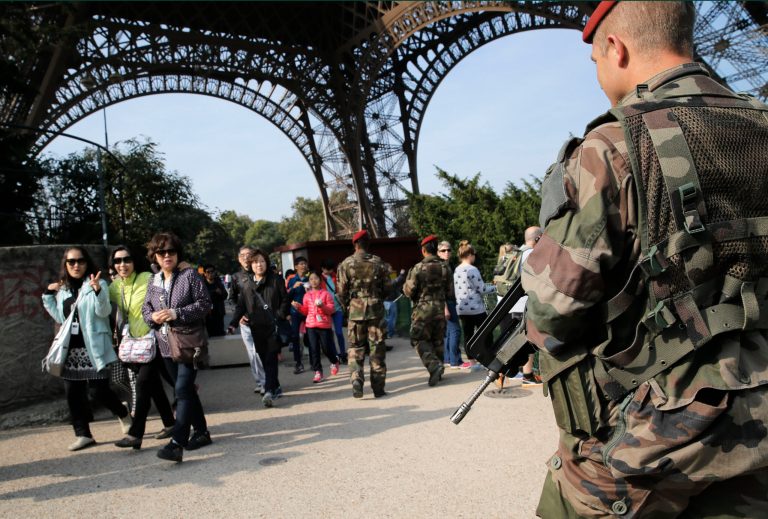 Soldiers patrol at the Eiffel Tower in Paris, France, Tuesday, Sept. 23, 2014. Frenchman Herve Gourdel, 55,  was abducted in Algeria on Monday by a splinter group from al-Qaida's North African branch. The Jund al-Khilafah, or Soldiers of the Caliphate, said it would kill him unless France halts it airstrikes in Iraq within 24 hours. French forces on Friday joined the U.S. in carrying out airstrikes against extremists who have overrun large areas of Syria and Iraq. (AP Photo/Christophe Ena)