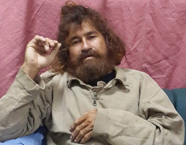 In this Monday, Feb. 3, 2014 photo provided by the Marshall Islands Foreign Affairs Department, a man identifying himself as 37-year-old Jose Salvador Alvarenga sits on a couch in Majuro in the Marshall Islands, after he was rescued from being washed ashore on the tiny atoll of Ebon in the Pacific Ocean.  Alvarenga told the U.S. ambassador in the Marshall Islands Tom Armbruster and the nation's officials that he left Mexico in December 2012 for a day of shark fishing and ended up surviving 13 months on fish, birds and turtles before washing ashore on the remote Marshall Islands thousands of miles (kilometers) away. (AP Photo/Foreign Affairs Department The Marshall Islands, Gee Bing)