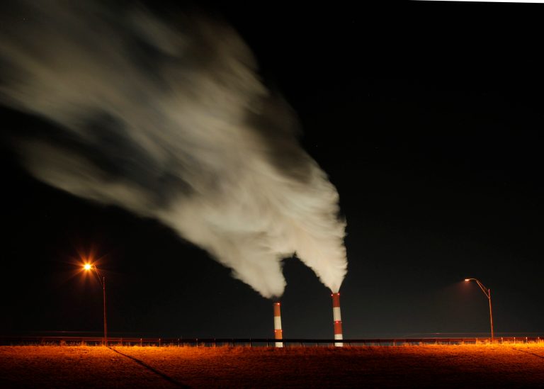 In this Jan. 19, 2012, file photo time exposure image smoke rises from the stacks of the La Cygne Generating Station coal-fired power plant in La Cygne, Kan. (AP Photo/Charlie Riedel, File)