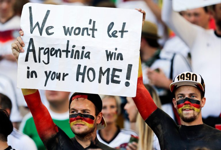 German supporters hold up a banner before the World Cup final soccer match between Germany and Argentina at the Maracana Stadium in Rio de Janeiro, Brazil, Sunday, July 13, 2014. (AP Photo/Matthias Schrader)