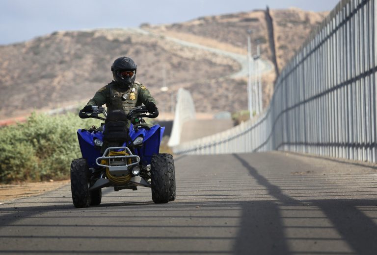 A U.S. Border Patrol agent patrols the U.S.-Mexico border fence at Friendship Park on November 17, 2013 in San Diego, California. (Photo by John Moore/Getty Images)