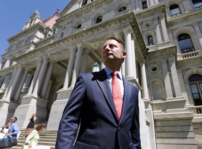 Republican candidate for governor Rob Astorino leaves a news conference outside the Capitol on Monday, June 16, 2014, in Albany, N.Y. Astorino unveiled a 10-point ethics proposal on Monday. He says eight-year term limits for statewide elected leaders and legislators and a three-month legislative session would discourage the insider politics that he says has caused a 