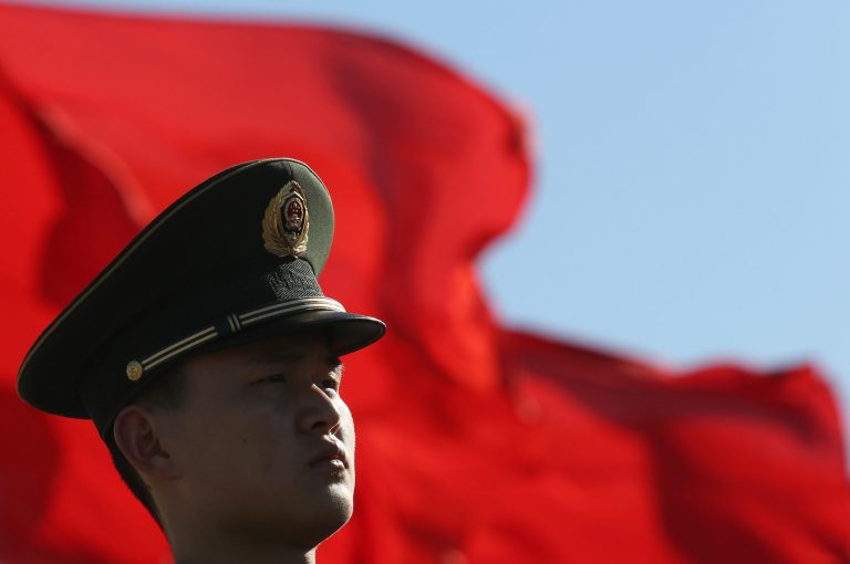 A Chinese paramilitary policeman stands guard on Tiananmen Square while sessions of the National People's Congress and the Chinese People's Political Consultative Conference are held at the Great Hall of the People in Beijing Monday, March 4, 2013. The National People's Congress, which opens Tuesday, completes the leadership power transition initiated four months ago, approving top government appointments and giving the new leaders a platform to lay out policies. (AP Photo/Kin Cheung)