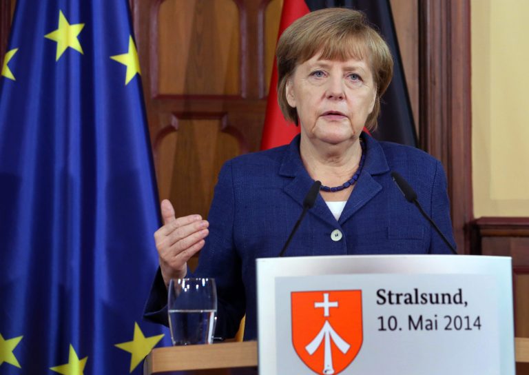German chancellor Angela Merkel  delivers a statement  during a press conference with French president Francois Hollande, in Stralsund, northern Germany, Saturday May 10, 2014 during the second day of Hollande's two days visit to Merkel's scenic home constituency on the Baltic coast . One of the main talking points was  expected to be over whether the European Union should impose further sanctions on Russia, for its involvement in the Ukraine crisis.    (AP Photo/dpa, Bernd Wuestneck)