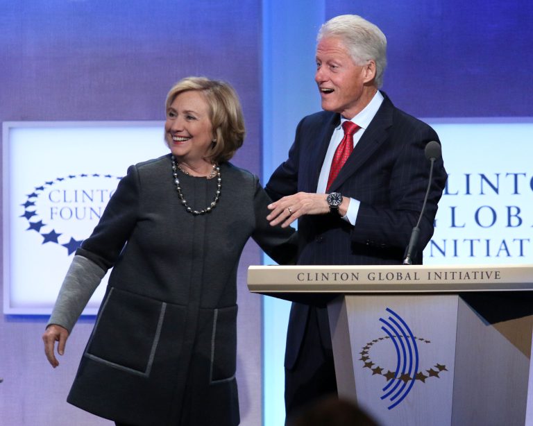 Former Secretary of State Hillary Rodham Clinton and former U.S. President Bill Clinton appear together on stage during a plenary session at the Clinton Global Initiative, Monday, Sept. 22, 2014 in New York. (Photo by Greg Allen/Invision/AP)