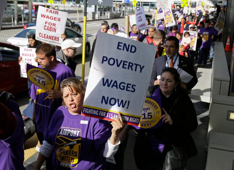 The new wage floors include steps on the way to $15-an-hour minimum wages in California and New York. (AP Photo/Eric Risberg)